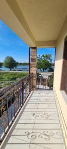 a balcony with a view of the water at Casa Carpov Sulina in Sulina