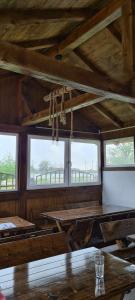 a room with tables and windows in a building at Casa Carpov Sulina in Sulina