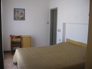 Postel nebo postele na pokoji v ubytování Hotel Eleonora