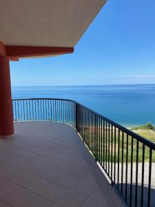 a balcony of a house with a view of the ocean at Tus'Hotel in Castel di Tusa