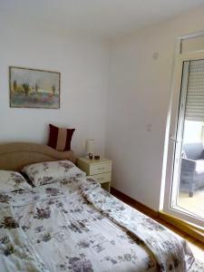 Ένα ή περισσότερα κρεβάτια σε δωμάτιο στο Jasna Apartman +31 φωτογραφίες
