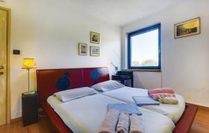Postel nebo postele na pokoji v ubytování Holiday home in Mali Lošinj with Pool, Whirpool, Terrace, Air conditioning, Wi-Fi, Washing machine 4780-1