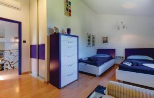 Postel nebo postele na pokoji v ubytování Holiday home in Mali Lošinj with Pool, Whirpool, Terrace, Air conditioning, Wi-Fi, Washing machine 4780-1