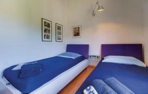 Postel nebo postele na pokoji v ubytování Holiday home in Mali Lošinj with Pool, Whirpool, Terrace, Air conditioning, Wi-Fi, Washing machine 4780-1