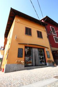a building with a store on the side of it at Vicolo del Pozzo in Barolo