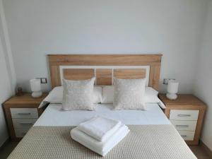 Postel nebo postele na pokoji v ubytování Apartamentos Clavero 10