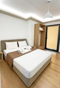 Posteľ alebo postele v izbe v ubytovaní apus apartments