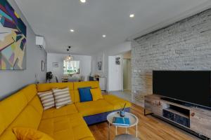 TV a/nebo společenská místnost v ubytování Apartments Piano
