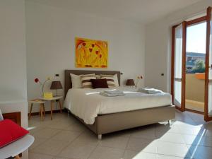 Posteľ alebo postele v izbe v ubytovaní Cagliari Family Apartment