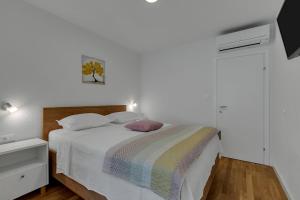 Postel nebo postele na pokoji v ubytování Apartments Piano