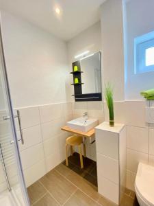 Ванна кімната в Pension / Ferienwohnungen Scheid