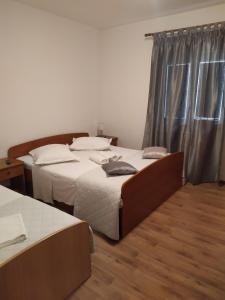 Postel nebo postele na pokoji v ubytování Krka Ivan
