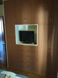 Televízia a/alebo spoločenská miestnosť v ubytovaní La Casa di Pietra