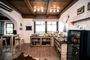 a large kitchen with a counter and a table at Golf & Ski Chalet in Mittersill