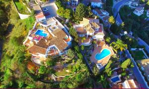 an aerial view of a house with a swimming pool at Villa Panorama Mijas Pueblo in Mijas
