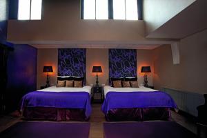 Postel nebo postele na pokoji v ubytování Hotel Sebastians