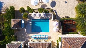 an overhead view of a swimming pool at a resort at Sandcastle Villa in Crocus Hill