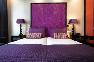 Postel nebo postele na pokoji v ubytování Hotel Sebastians