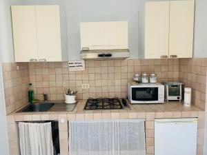 Kuchyň nebo kuchyňský kout v ubytování Casa Fè