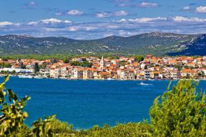 a town on the shore of a large body of water at Room in Vodice with balcony, air conditioning, Wi-Fi (4826-3) in Vodice +15 photos