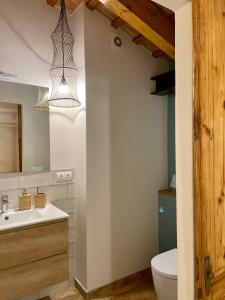 a bathroom with a sink and a toilet at Laindustria in Palamós +51 photos