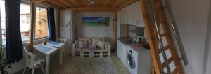 a small room with a washing machine and a table at INFINITY Blue 3 in Burgas