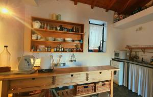 a kitchen with a wooden counter top in a room at Traditional Hillside Cottage in Gythio