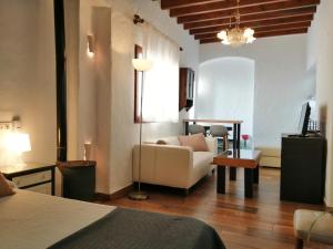 Łóżko lub łóżka w pokoju w obiekcie La Guarida de Vejer Casa Rural