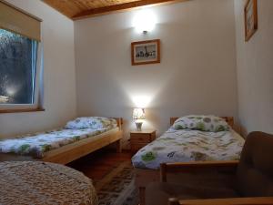 a bedroom with two beds and a window at Agroturystyka GAGA in Ustka