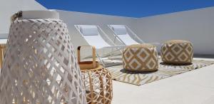 a group of three chairs sitting on top of a boat at Casa Mirella in Favignana