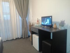 TV a/nebo společenská místnost v ubytování Vila Eclipse