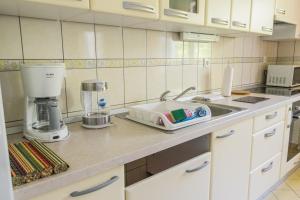 a kitchen counter with a mixer and a sink at Apartments Joseph and Mary in Trogir