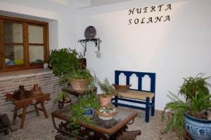 a living room filled with lots of potted plants at Huerta Solana in Castril