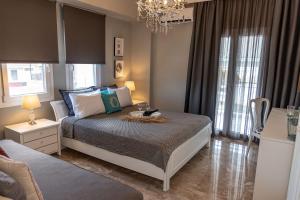 A bed or beds in a room at Mageiras Boutique Hotel
