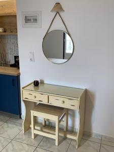 a dressing table with a mirror on a wall at Argo in Skala +63 photos