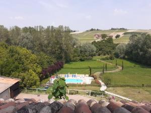 a soldier standing on top of a house with a pool at Casa Vacanze I Boidi in Nizza Monferrato