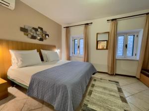 Ένα ή περισσότερα κρεβάτια σε δωμάτιο στο Rooms and Apartments Villa Town Gate Hvar