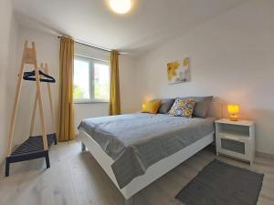 Postel nebo postele na pokoji v ubytování Green City Point Apartment