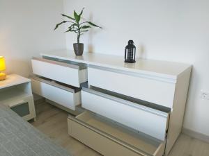 Postel nebo postele na pokoji v ubytování Green City Point Apartment