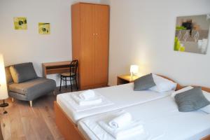Postel nebo postele na pokoji v ubytování Apartmani Alavuk
