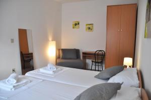 Postel nebo postele na pokoji v ubytování Apartmani Alavuk