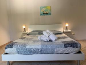 Cama o camas de una habitación en Quirino Residence