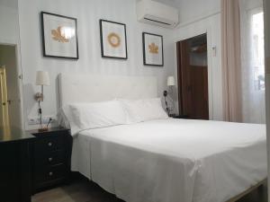Łóżko lub łóżka w pokoju w obiekcie Apartment Tirso Molina