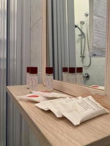 a bathroom counter with a sink and a mirror at Quirino Residence in Gaeta