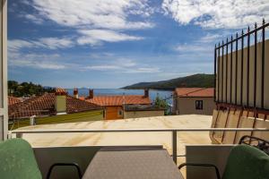 a balcony with a view of the ocean at zdenka in Rabac