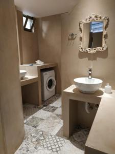A bathroom at Alexena Apartments