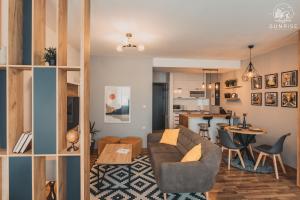 a living room with a couch and a table at Sunrise Luxury Apartment in Bitola