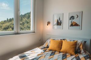 Ein Bett oder Betten in einem Zimmer der Unterkunft Sunrise Luxury Apartment