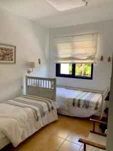 Ένα ή περισσότερα κρεβάτια σε δωμάτιο στο Meloneras ideal