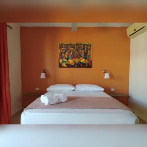 Postel nebo postele na pokoji v ubytování Hotel Pedernales Italia Republica Dominicana